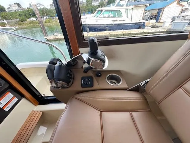 Seahorse Yacht Photos Pics 2019 Ranger Tugs R-41 CB helm station with controls and leather seating.