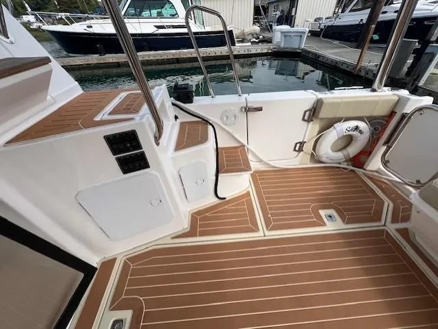 Seahorse Yacht Photos Pics 2019 Ranger Tugs R-41 CB boat deck with wood finish and safety equipment.
