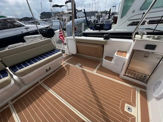 Seahorse Yacht Photos Pics 2019 Ranger Tugs R-41 CB boat deck with seating and wood flooring at marina.