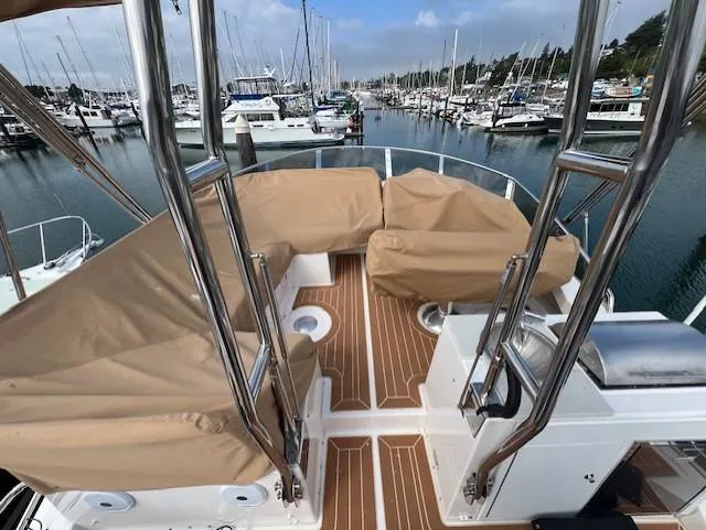 Seahorse Yacht Photos Pics 2019 Ranger Tugs R-41 CB boat deck with covered seating, docked in a marina.