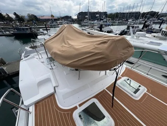 Seahorse Yacht Photos Pics 2019 Ranger Tugs R-41 CB yacht with covered seating area, docked in marina.