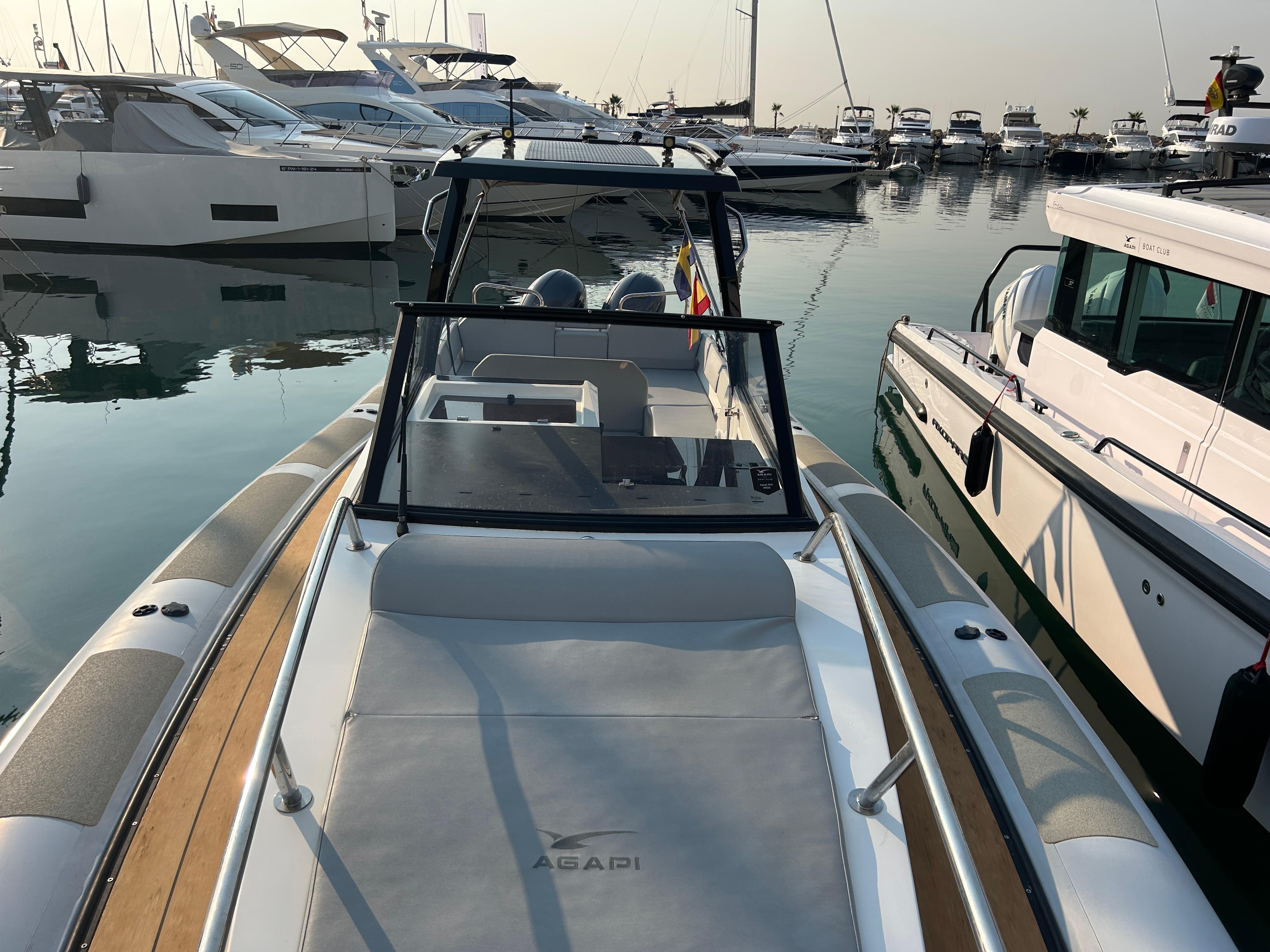 Agapi 950 boat, 2017 model, docked in a marina with other yachts.