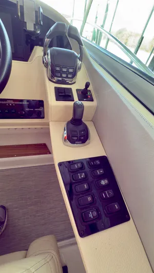  Yacht Photos Pics Control panel of a 2020 Regal 33 Express boat with joystick and switches.