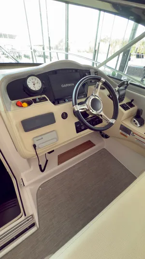  Yacht Photos Pics 2020 Regal 33 Express helm with Garmin display and modern steering wheel.