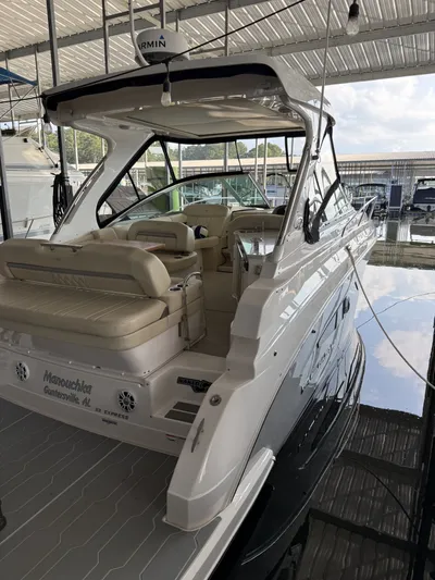  Yacht Photos Pics 2020 Regal 33 Express boat docked under a covered marina.