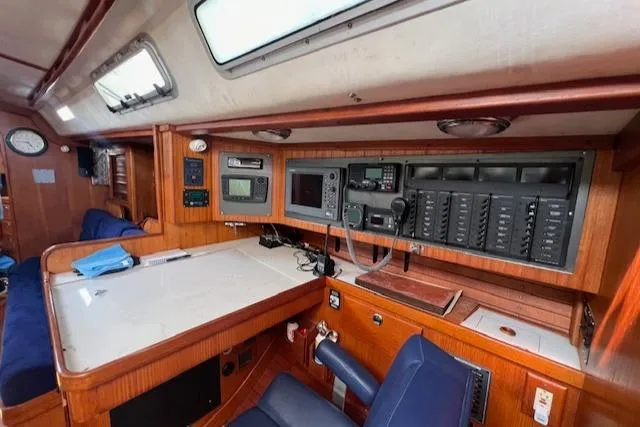 Lightwave Yacht Photos Pics Navigation station inside 1994 J Boats J 44, featuring control panels and seating.