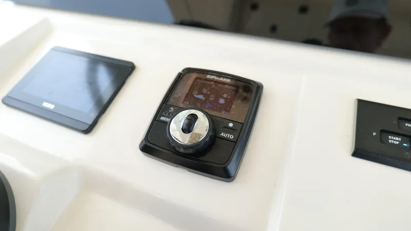 Engine Warranty X Trailer Yacht Photos Pics Control panel of 2022 Scout 330 LXF boat with navigation and start-stop features.