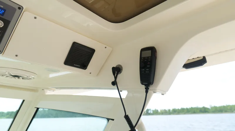 Engine Warranty X Trailer Yacht Photos Pics Interior of 2022 Scout 330 LXF boat with Garmin marine radio equipment.