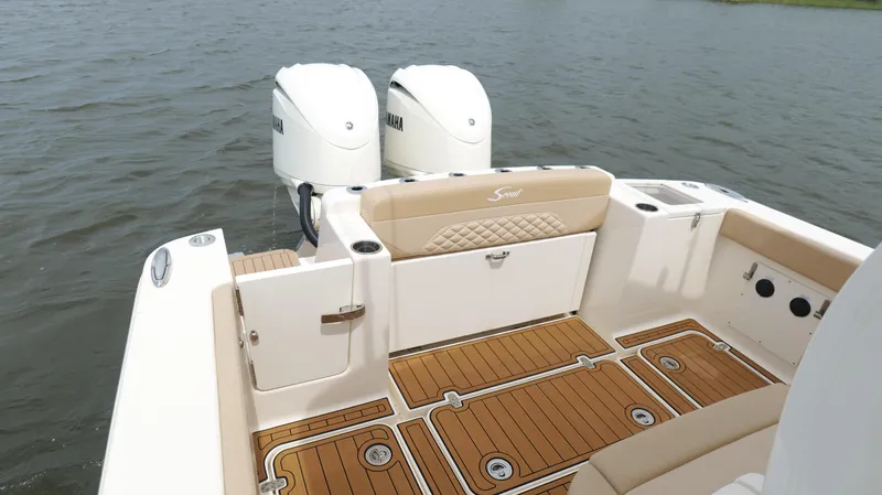 Engine Warranty X Trailer Yacht Photos Pics 2022 Scout 330 LXF boat with Yamaha engines, featuring teak flooring and cushioned seating.