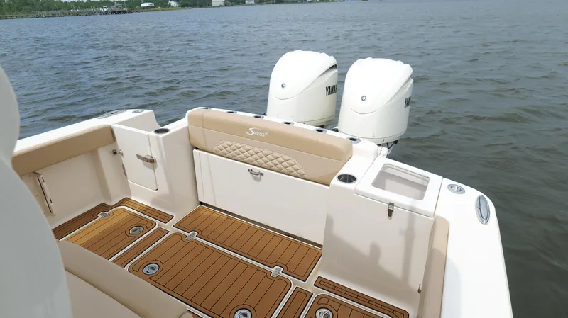 Engine Warranty X Trailer Yacht Photos Pics 2022 Scout 330 LXF boat with Yamaha engines on a calm lake.