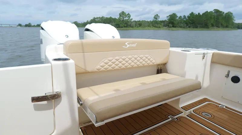 Engine Warranty X Trailer Yacht Photos Pics 2022 Scout 330 LXF boat with beige seating and dual engines on a lake.