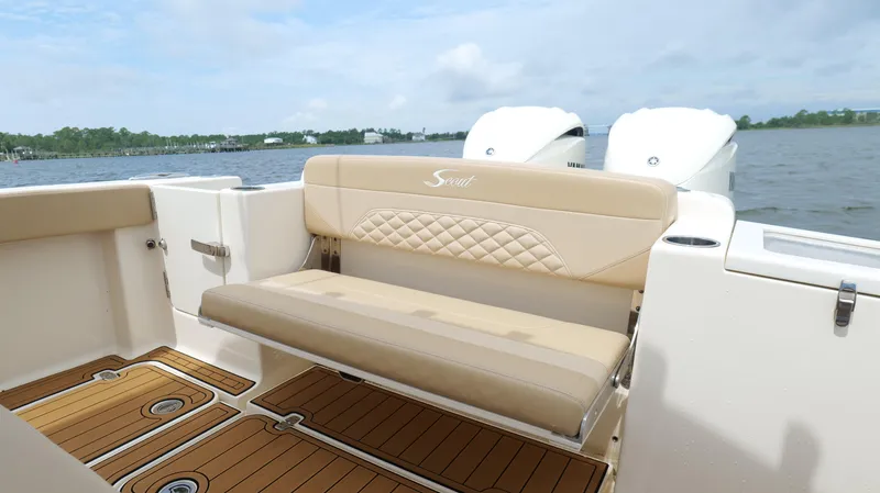 Engine Warranty X Trailer Yacht Photos Pics 2022 Scout 330 LXF boat interior with beige seating and teak flooring.