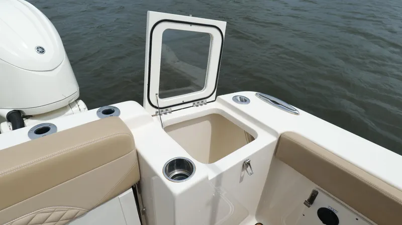 Engine Warranty X Trailer Yacht Photos Pics 2022 Scout 330 LXF boat interior with open storage compartment.