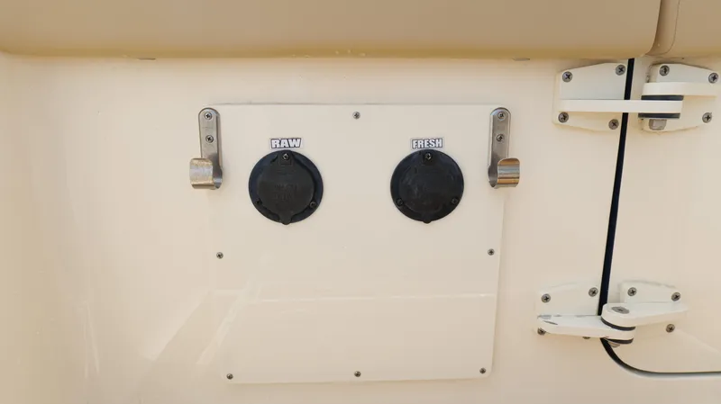 Engine Warranty X Trailer Yacht Photos Pics 2022 Scout 330 LXF boat water outlets labeled "RAW" and "FRESH."
