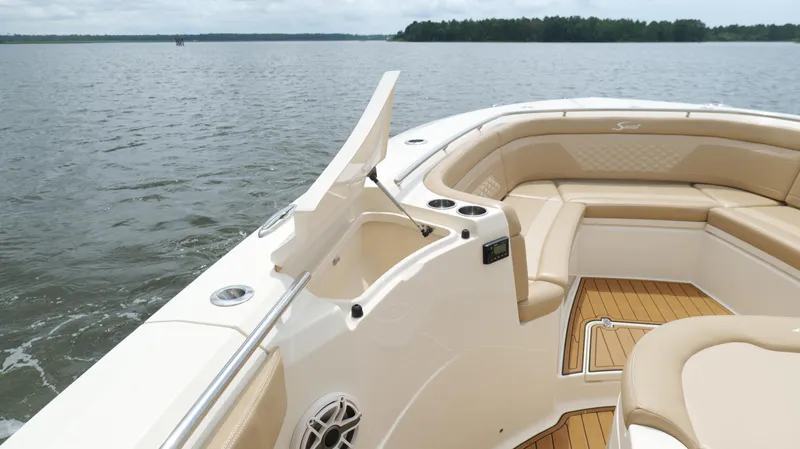 Engine Warranty X Trailer Yacht Photos Pics 2022 Scout 330 LXF boat interior with tan seating and open water view.