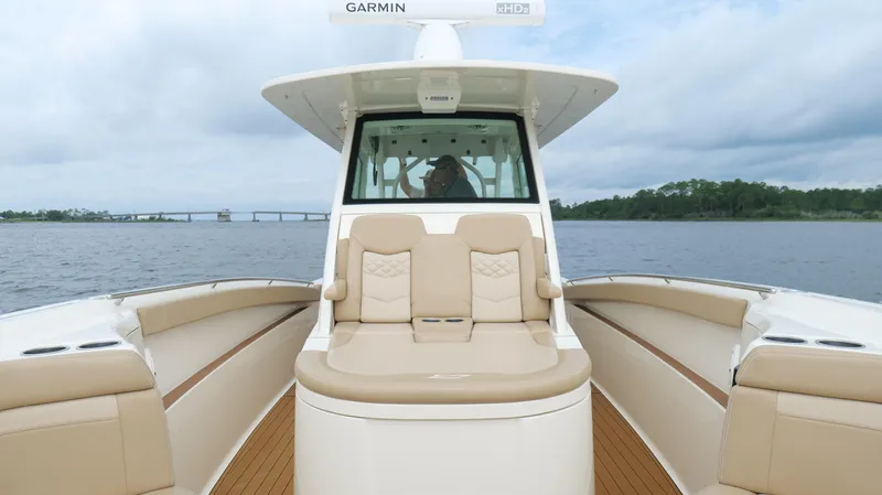 Engine Warranty X Trailer Yacht Photos Pics 2022 Scout 330 LXF boat on water, featuring luxurious seating and modern design.