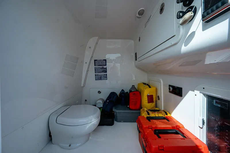 Fifty/50 Yacht Photos Pics Interior of 2019 Invincible 37 Catamaran with toilet and storage compartments.