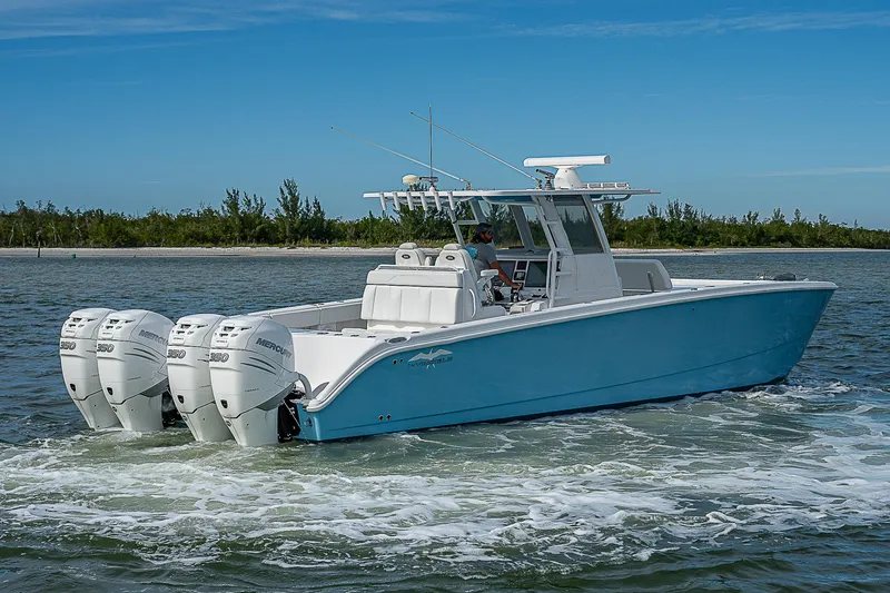 Fifty/50 Yacht Photos Pics 2019 Invincible 37 Catamaran cruising on water with four outboard engines.