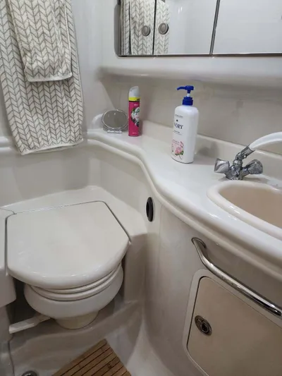  Yacht Photos Pics Bathroom interior of 2006 Sea Ray 340 Sundancer yacht with sink and toilet.