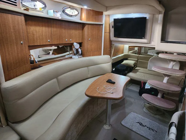  Yacht Photos Pics Interior of 2006 Sea Ray 340 Sundancer yacht with leather seating and wooden cabinetry.