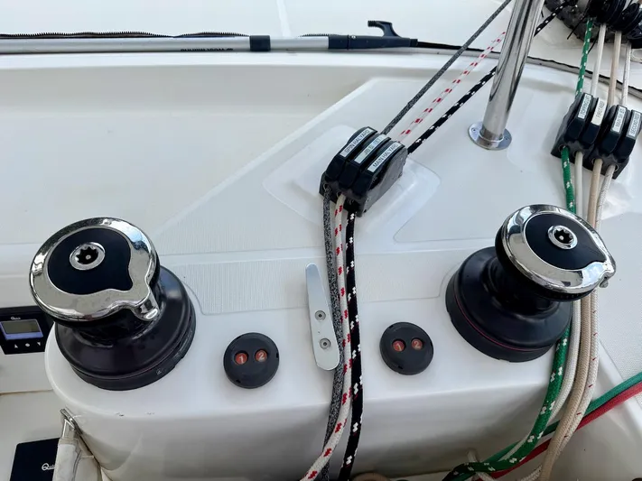 Orion Yacht Photos Pics Control panel of a 2019 Lagoon 42 catamaran with winches and ropes.