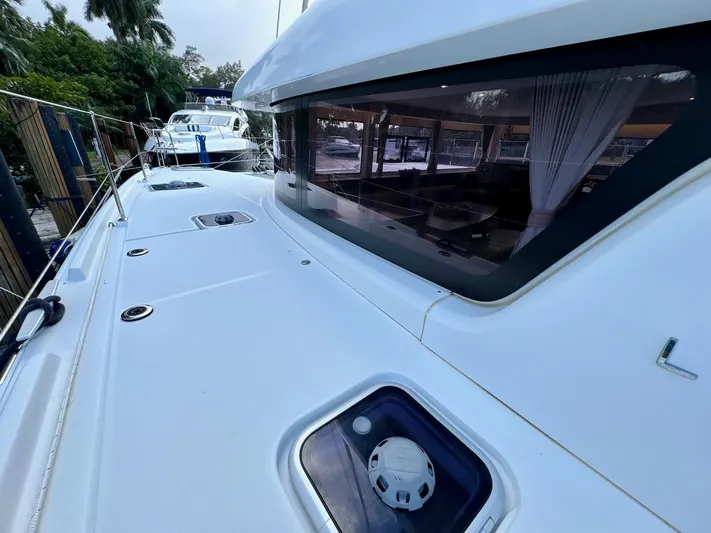 Orion Yacht Photos Pics 2019 Lagoon 42 yacht deck with sleek design and spacious interior view.