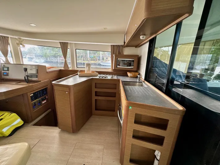 Orion Yacht Photos Pics Interior of 2019 Lagoon 42 catamaran featuring modern kitchen and spacious layout.