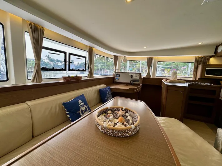 Orion Yacht Photos Pics Interior of 2019 Lagoon 42 catamaran with elegant seating and nautical decor.