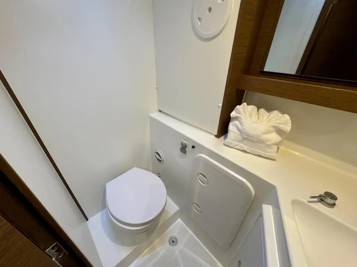 Orion Yacht Photos Pics Bathroom interior of 2019 Lagoon 42 yacht, featuring modern fixtures and compact design.