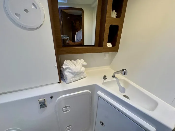 Orion Yacht Photos Pics Modern bathroom interior of 2019 Lagoon 42 yacht with sink and mirror.