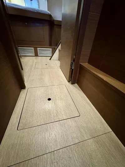 Orion Yacht Photos Pics Interior of 2019 Lagoon 42 yacht, featuring wooden flooring and storage compartments.