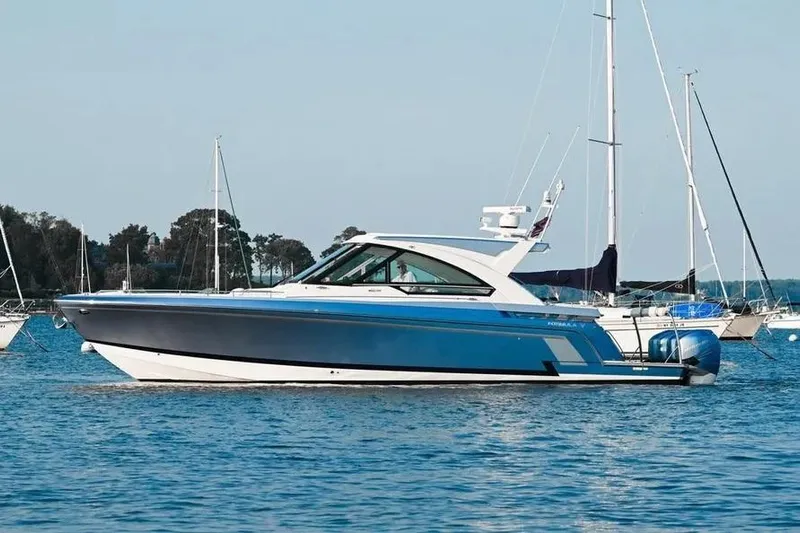  Yacht Photos Pics 2020 Formula 400 Super Sport Crossover boat on calm water, surrounded by sailboats.
