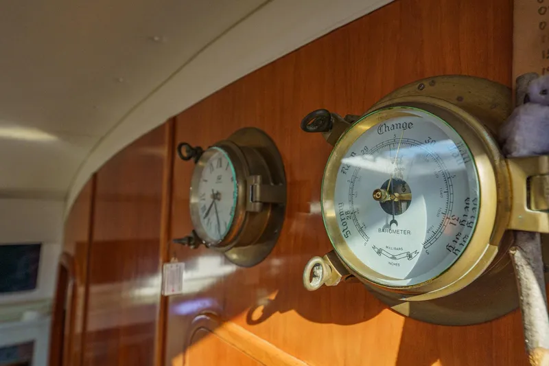Solitude Yacht Photos Pics Barometer and clock on wooden panel inside 1995 Prout 45 yacht.