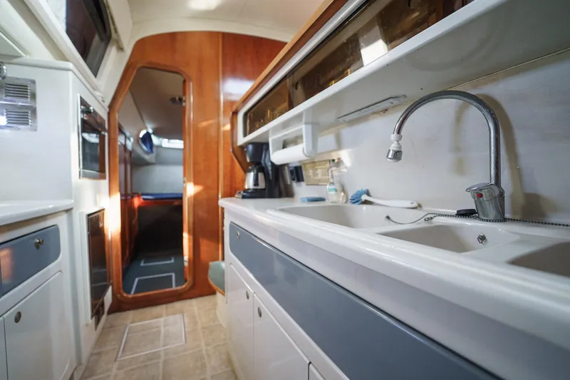 Solitude Yacht Photos Pics Interior of a 1995 Prout 45 yacht, featuring a modern kitchen area.