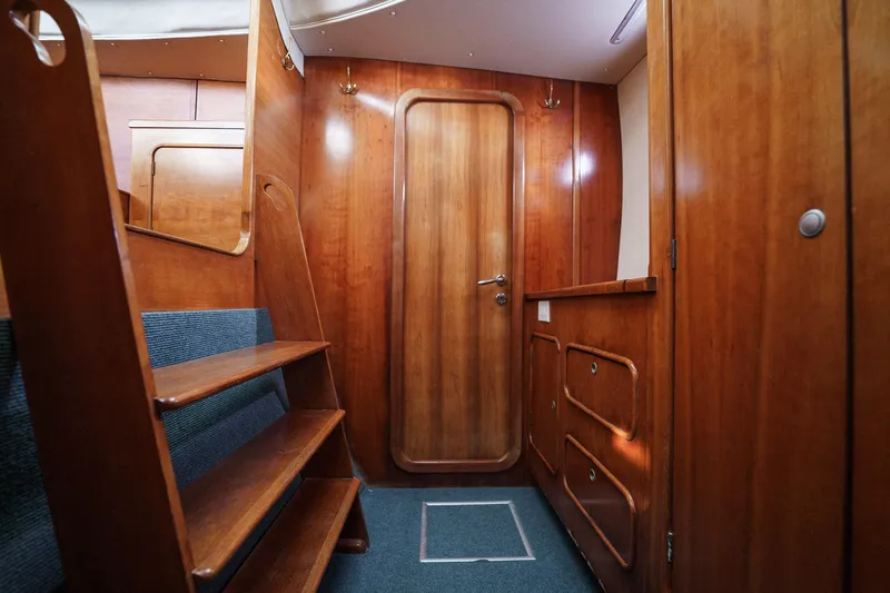 Solitude Yacht Photos Pics Interior of 1995 Prout 45 yacht with wooden finishes and stairs.