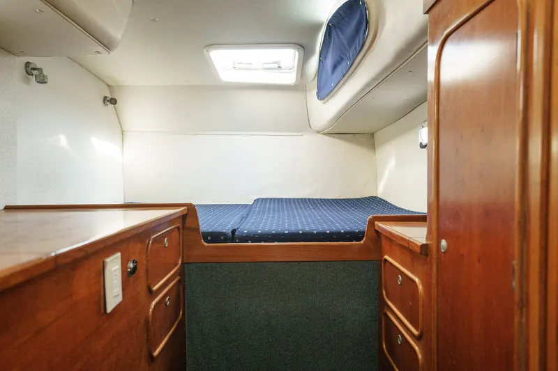 Solitude Yacht Photos Pics Cozy cabin interior of a 1995 Prout 45 yacht with wooden furnishings.