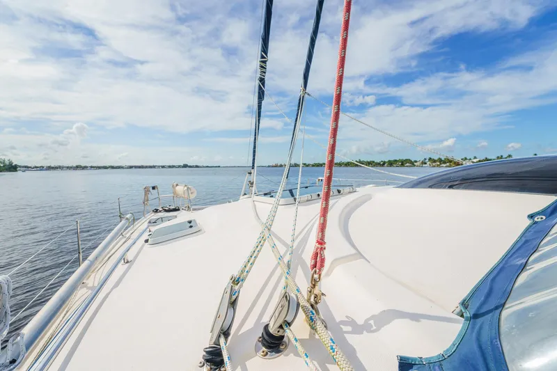 Solitude Yacht Photos Pics Sailing on a 1995 Prout 45 catamaran under a clear blue sky.