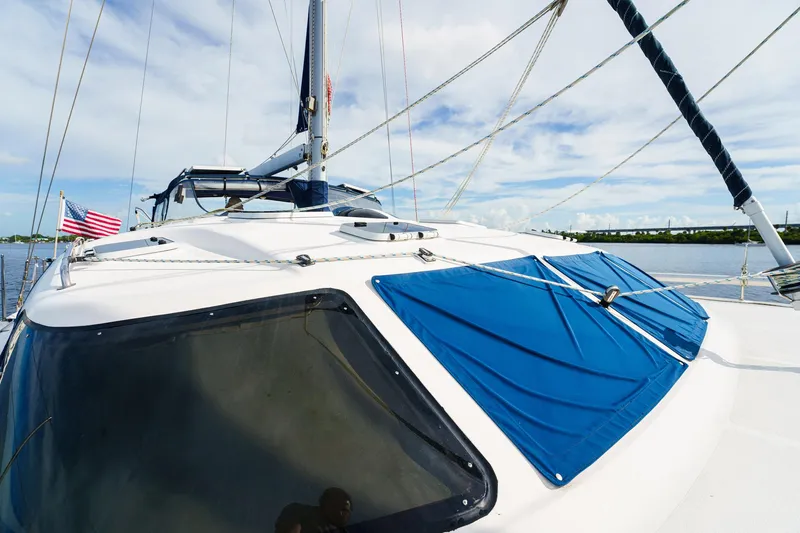 Solitude Yacht Photos Pics Sailing catamaran Prout 45, 1995 model, with blue sunshades and American flag.
