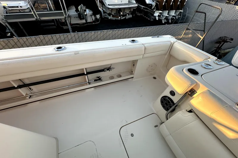 Killer B Yacht Photos Pics 2019 Grady-White Canyon 336 boat interior with rod holders and seating.
