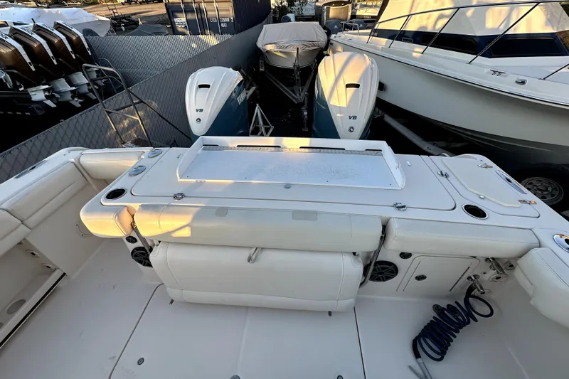Killer B Yacht Photos Pics 2019 Grady-White Canyon 336 boat deck with Yamaha V8 engines in marina.