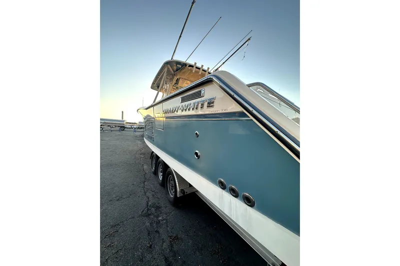 Killer B Yacht Photos Pics 2019 Grady-White Canyon 336 boat on trailer, side view at sunset.