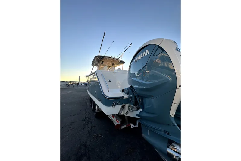 Killer B Yacht Photos Pics 2019 Grady-White Canyon 336 boat with Yamaha engine, docked at sunset.