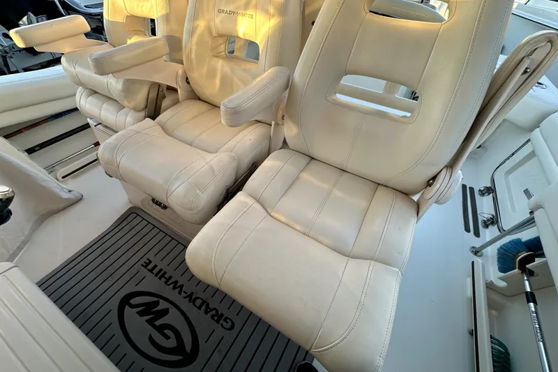 Killer B Yacht Photos Pics 2019 Grady-White Canyon 336 boat interior with plush seating and branded floor mat.