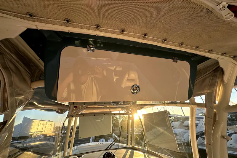 Killer B Yacht Photos Pics 2019 Grady-White Canyon 336 boat interior with sunset reflection on storage compartment.