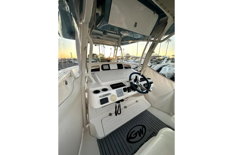 Killer B Yacht Photos Pics 2019 Grady-White Canyon 336 boat interior with steering wheel and control panel.
