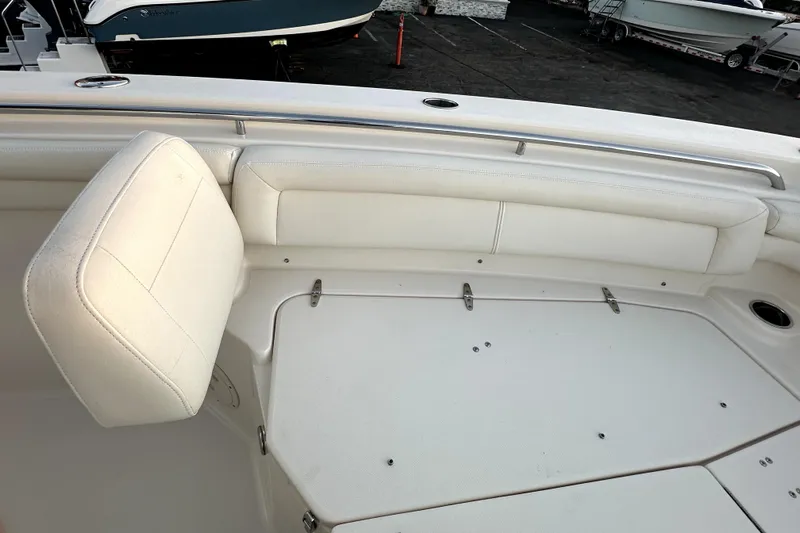 Killer B Yacht Photos Pics 2019 Grady-White Canyon 336 boat interior with white seating and storage compartments.