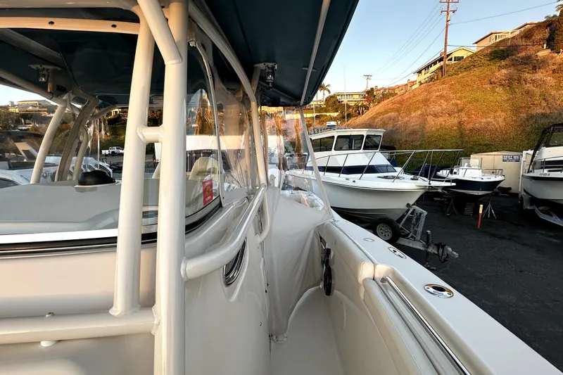 Killer B Yacht Photos Pics 2019 Grady-White Canyon 336 boat docked, side view with other boats nearby.