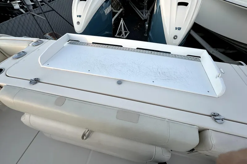 Killer B Yacht Photos Pics 2019 Grady-White Canyon 336 boat with Yamaha V8 engines, featuring a scratched cutting board.