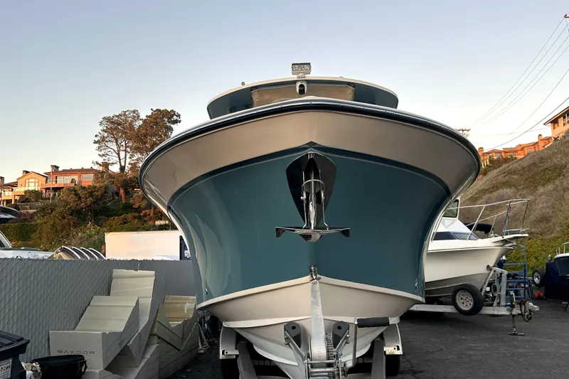Killer B Yacht Photos Pics 2019 Grady-White Canyon 336 boat on trailer, front view, outdoor setting.