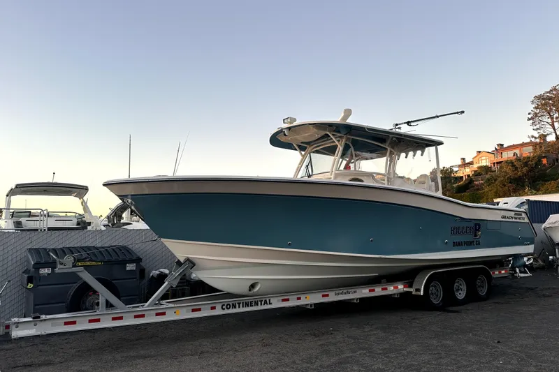 Killer B Yacht Photos Pics 2019 Grady-White Canyon 336 boat on trailer, parked outdoors.